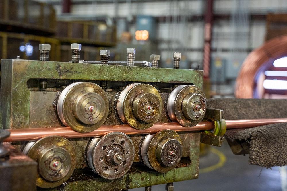 tube-fabricator-rebuilds-line-of-cutoff-machines-1677100819 Steel coil feeding system supplying continuous material into high-speed tube cutting machine